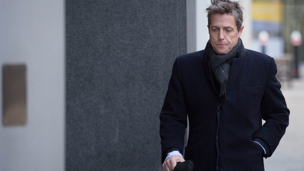 Hugh Grant arriving at the Rolls Building in central London for the High Court hearing.