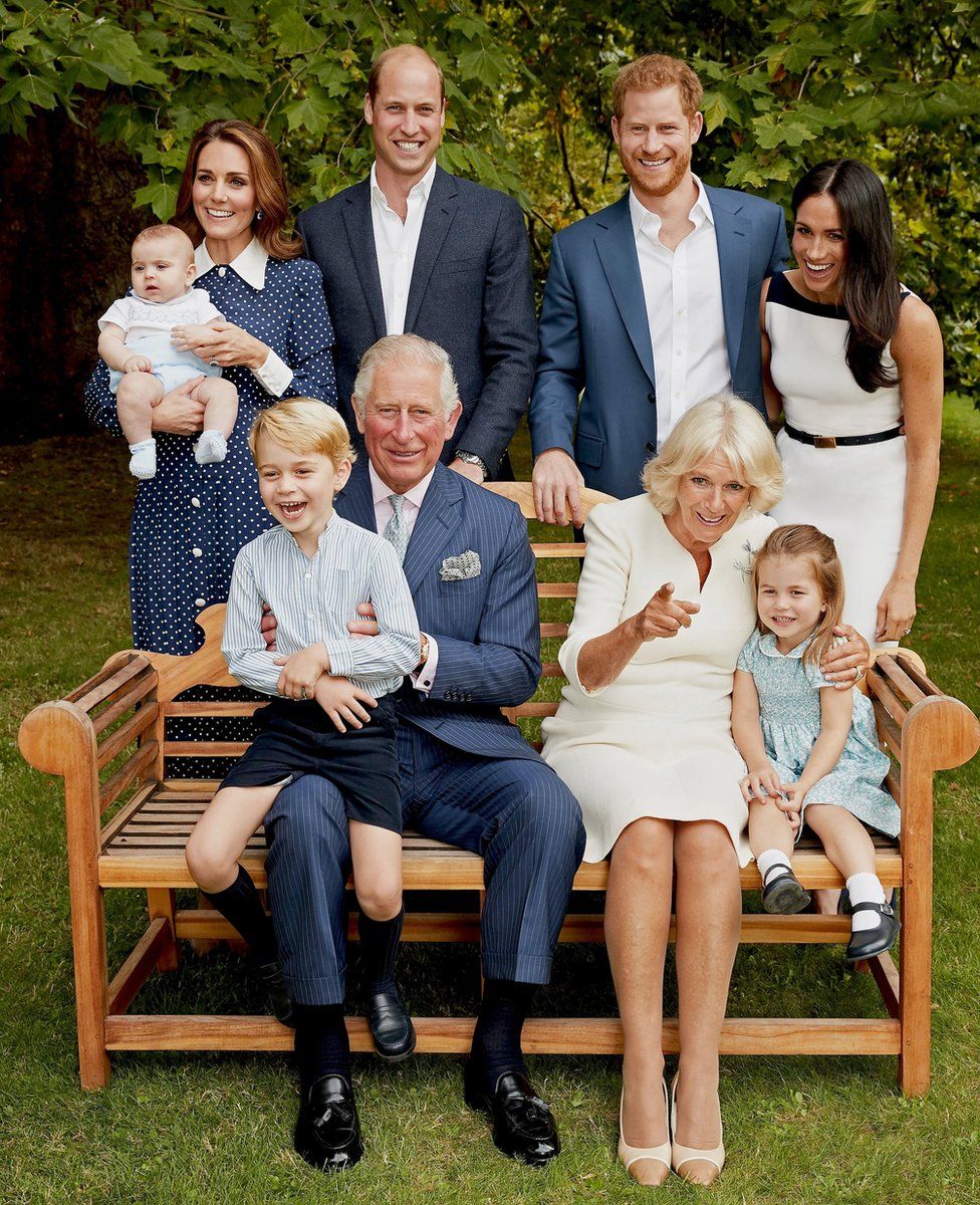 Prince Louis, the Duchess of Cambridge, the Duke of Cambridge, the Duke of Sussex and the Duchess of Sussex. (front row left to right) Prince George, the Prince of Wales, the Duchess of Cornwall and Princess Charlotte, in the gardens of Clarence House