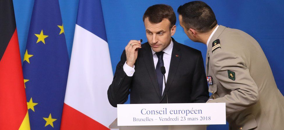 French President Emmanuel Macron is informed by his security adviser about the hostage situation in Trebes, 23 March 2018