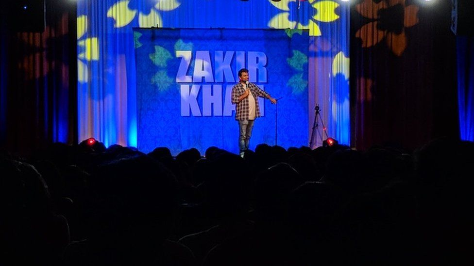 Comedian Zakir Khan performing on stage