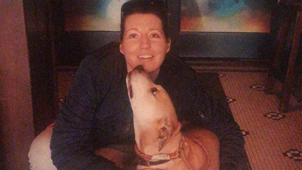 Jean Tighe with a labrador dog