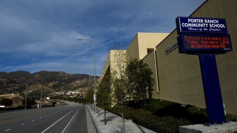 Deserted streets and a sign (right) advising students to attend another school are pictured outside the Porter Ranch Community School, closed after a continuing gas leak that started in October (23 January 2016)