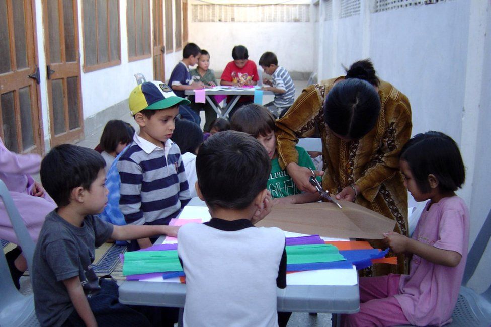 Arson Fahim, wearing a cap, in class at the orphanage in Pakistan