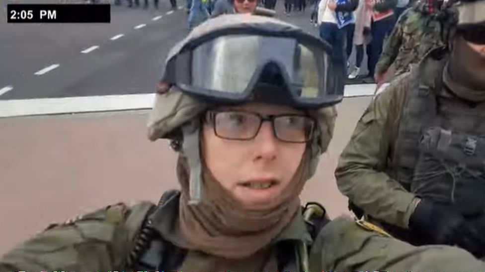 A still from a video shot by Jessica Watkins as she marched to the Capitol on 6 January. It shows Watkins dressed in military-style gear