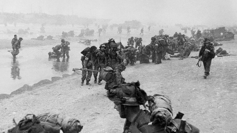 American troops wade shoreward on Utah Beach in France