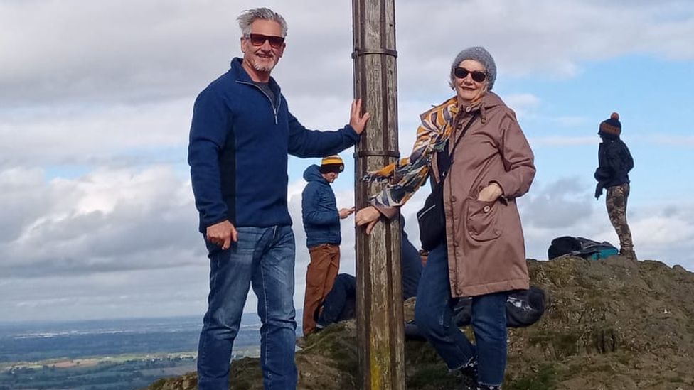 Jennifer Baker and her partner Stephen Sharman standing on a hill