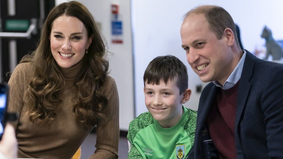 The Duke and Duchess of Cambridge meet Carole Ellis and her great grandson Deacon Glover,11, whose mother, Grace Taylor has passed away, during a visit to charity, Church on the Street, in Burnley, Lancashire,