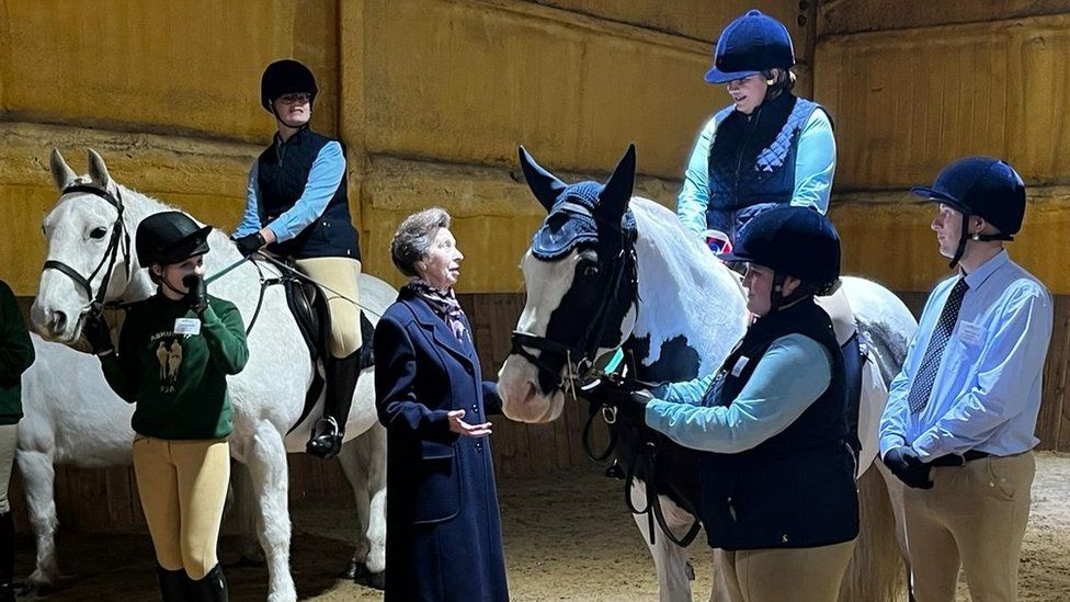 Princess Anne speaking to riders