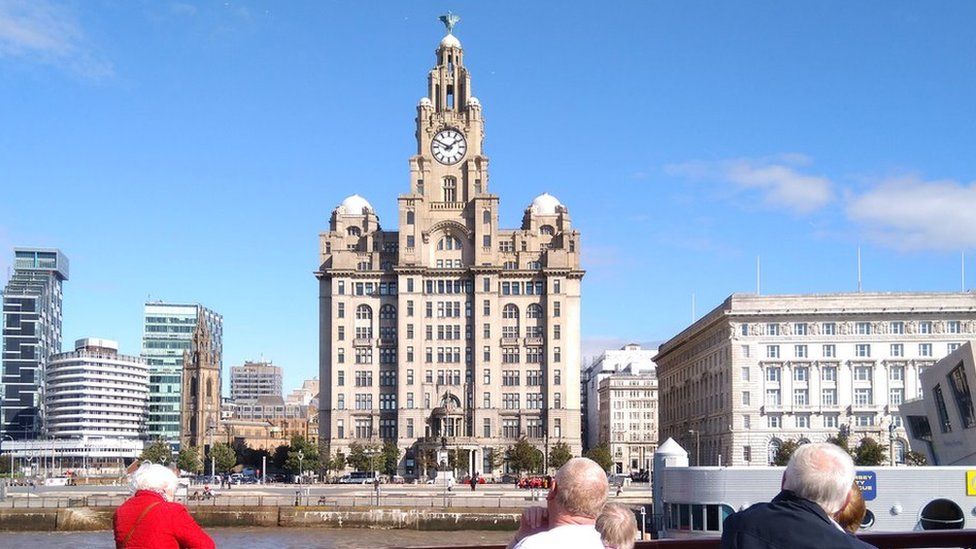 People view Liverpool waterfront from a ferry