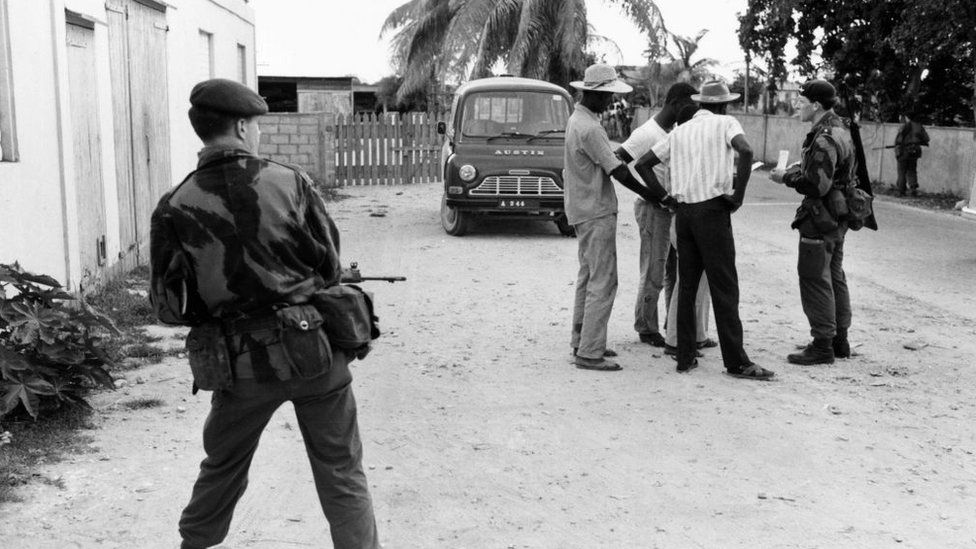 Paratroopers searching civilians during the British military operation in Anguilla