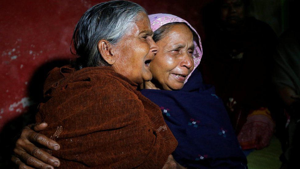 An elderly woman cries as she hugs Bonomala Santra (R), mother of Bablu Santra, a Central Reserve Police Force (CRPF) trooper killed on Thursday, at Bauria village in Howrah district, West Bengal