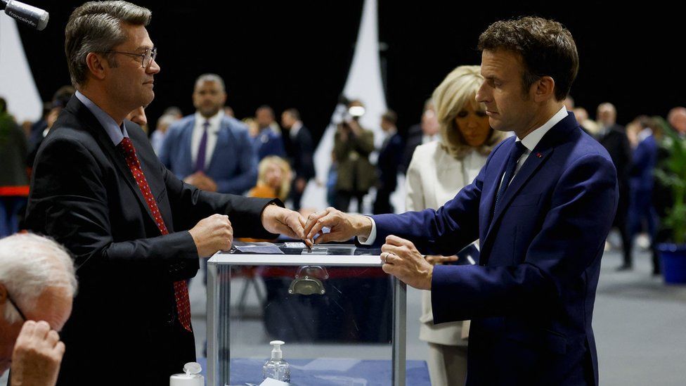 French President Emmanuel Macron, candidate for his re-election, votes in the second round of the 2022 French presidential election, at a polling station in Le Touquet-Paris-Plage