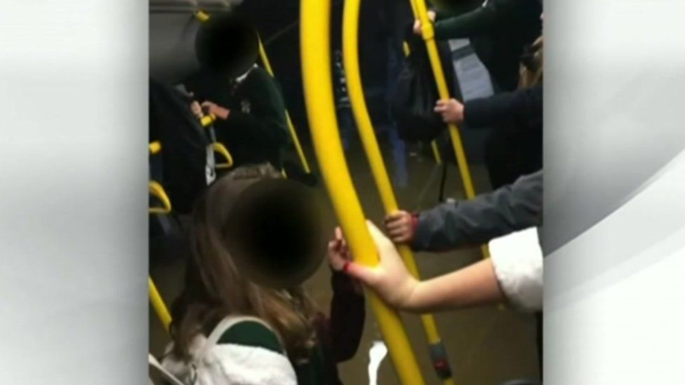 School children on flooded bus