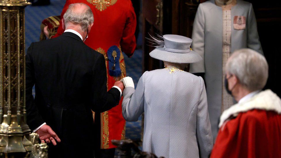 Queen Elizabeth II with Prince Charles, Prince of Wales depart the House of Lord's Chamber during the State Opening of Parliament at the House of Lords