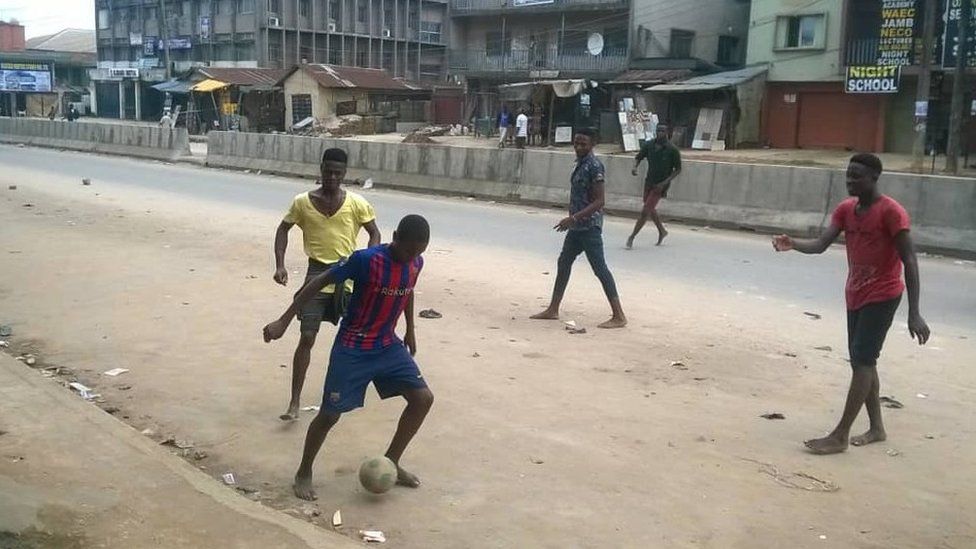 The children playing football on a street in Ariaria in Abia state