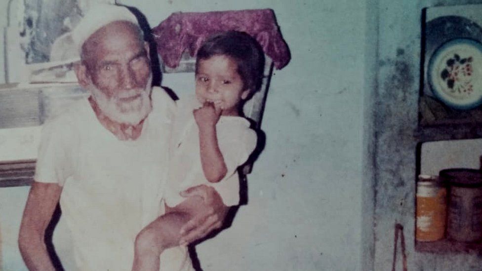 Мохаммед Али с одним из своих внуков
