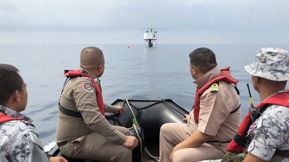 Thai Navy handout shows the home as a patrol boat approaches