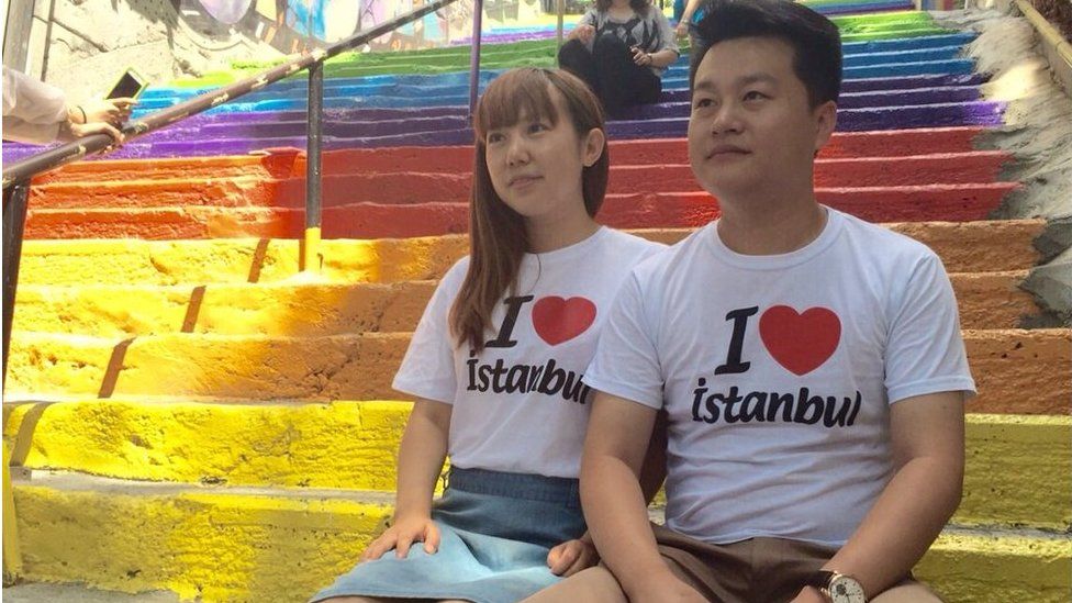 A Chinese couple wears 'I love Istanbul' t-shirts