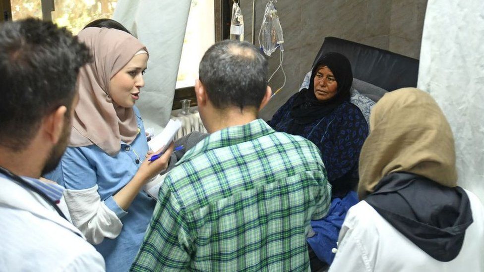 A woman with cholera receives treatment at a hospital in Syria's northern city of Aleppo on 11 September 2022