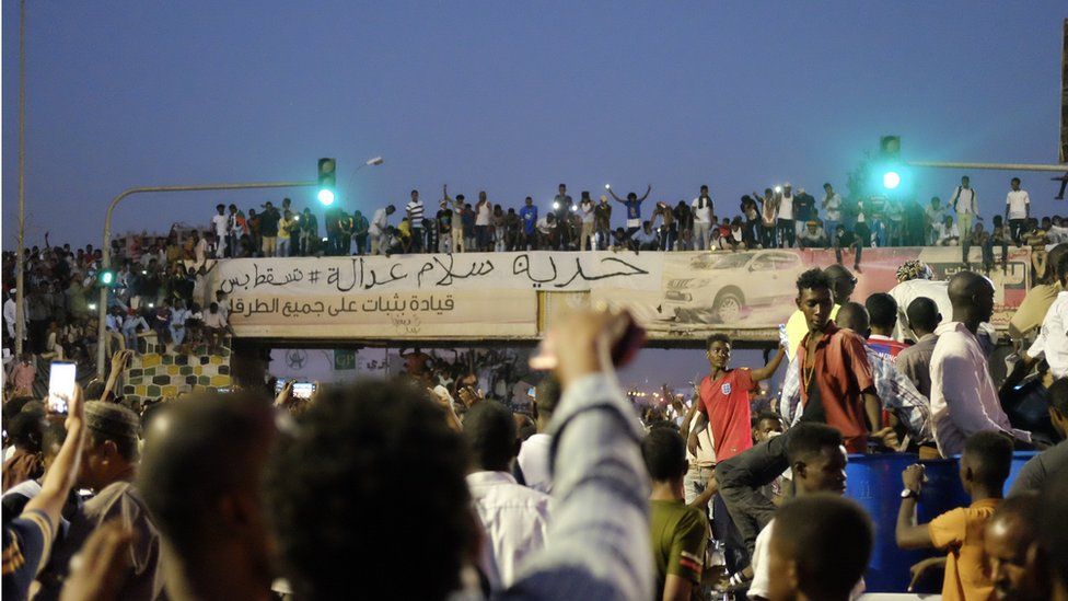 The banner reading: "Freedom, peace and justice" at a sit-in at the military HQ in Khartoum, Sudan - Sunday 7 April 2019