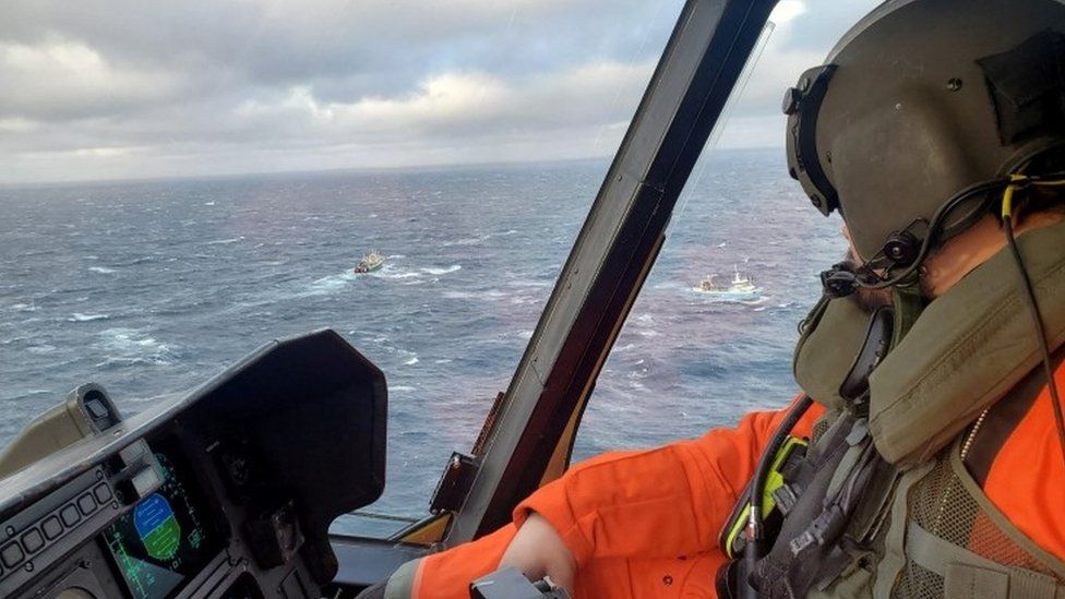 Search vessels are seen from a plane off Canada's eastern coast