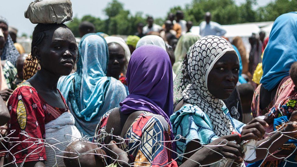 Women and children queue to enter a Unicef nutrition clinic in Borno state - September 2016