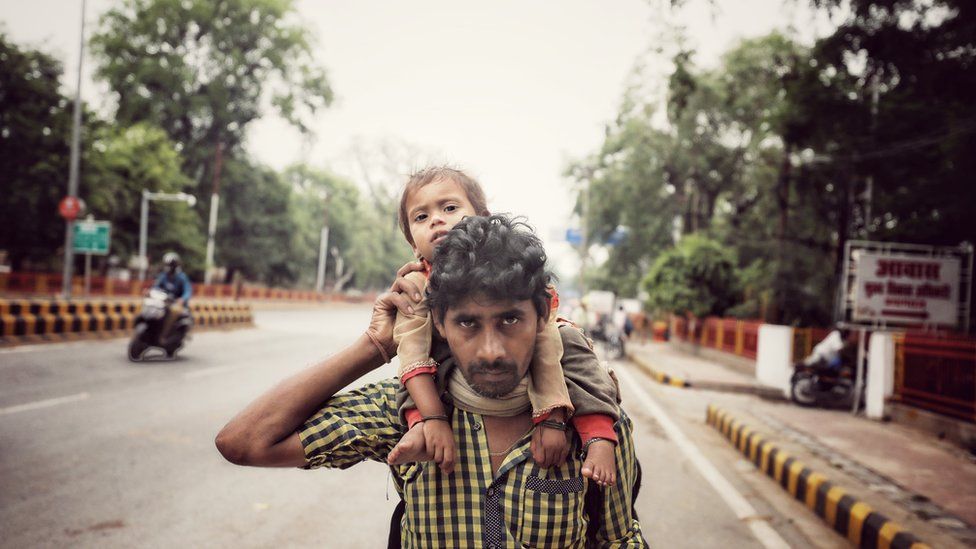 A migrant worker with his daughter