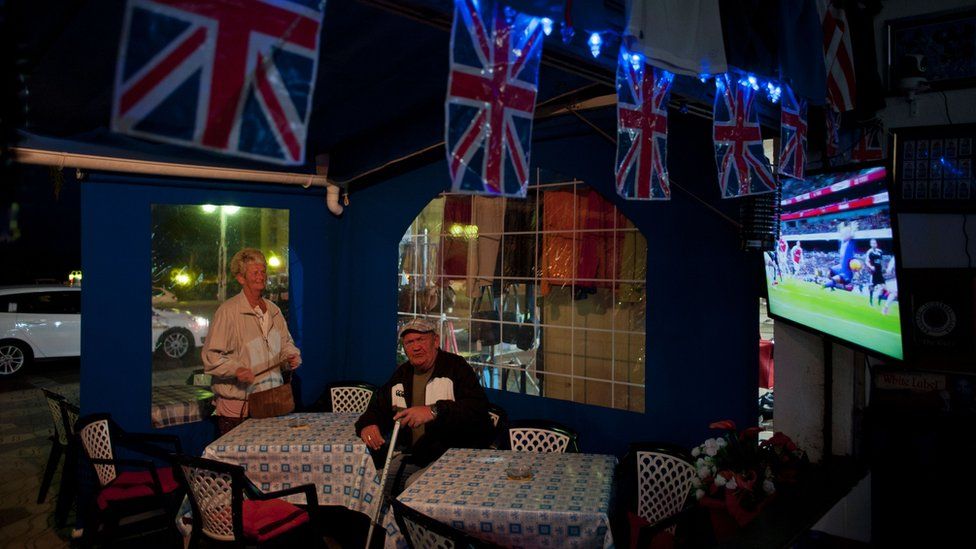 Elderly couple in British bar in Spain