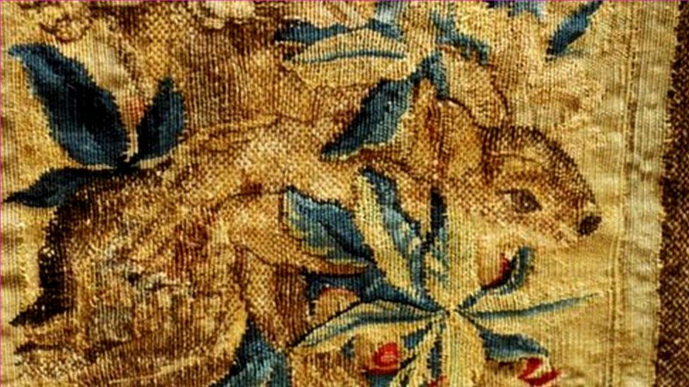 Squirrel woven into tapestry