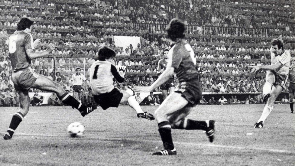 Gerry Armstrong blasts the ball into the net against Spain