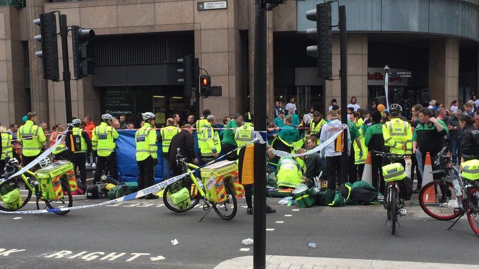 A runner is treated by paramedics