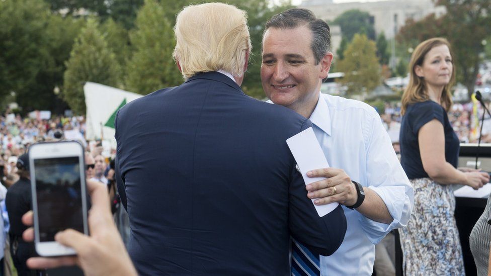 Donald Trump and Ted Cruz embrace on a Washington, DC, stage.