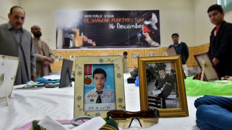 Belongings of people who died in the Taliban school massacre that left 151 people dead are displayed in a library on the first anniversary of the school massacre at the Army Public School in Peshawar on December 16, 2015.