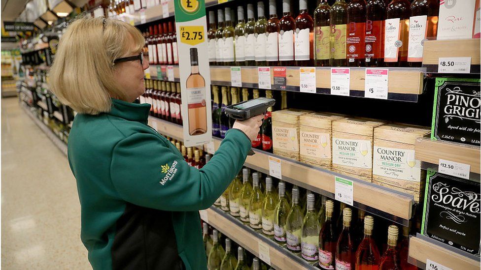 Woman labelling goods