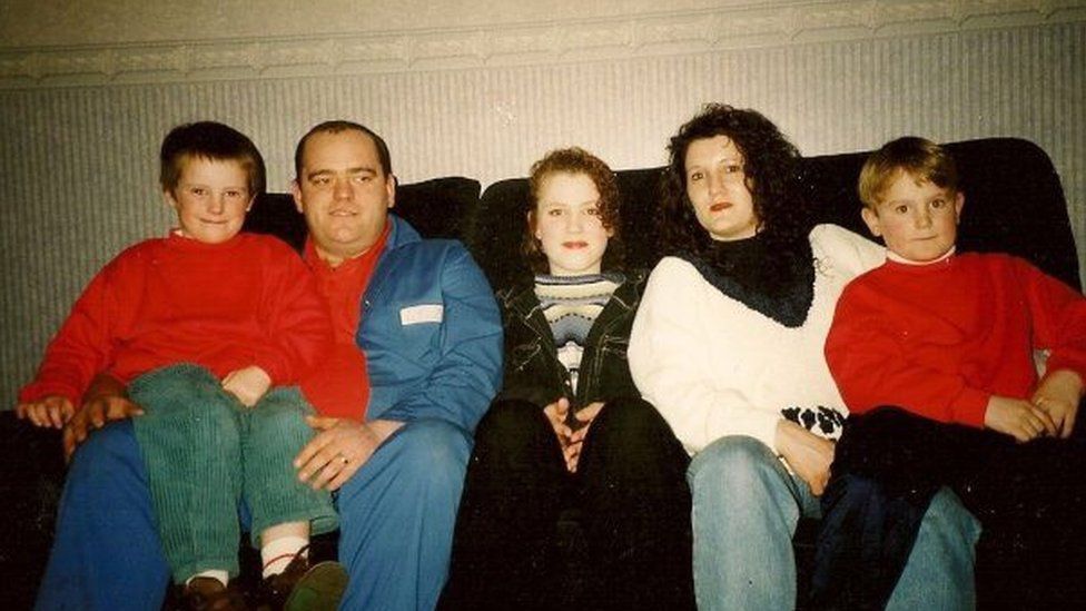 Laura (centre) with her foster family