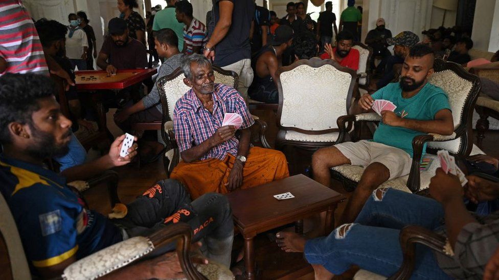 People play cards in the official residence of Sri Lanka's prime minister