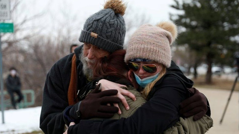 Sarah Moonshadow is comforted by David and Maggie Prowell after Moonshadow was inside King Soopers grocery store during a shooting in Boulder, Colorado, on 22 March 2021.