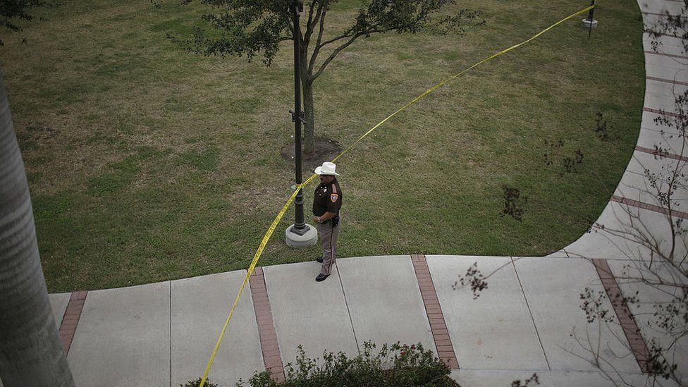 A Texas sheriff's deputy guards a university campus during a political event in 2007
