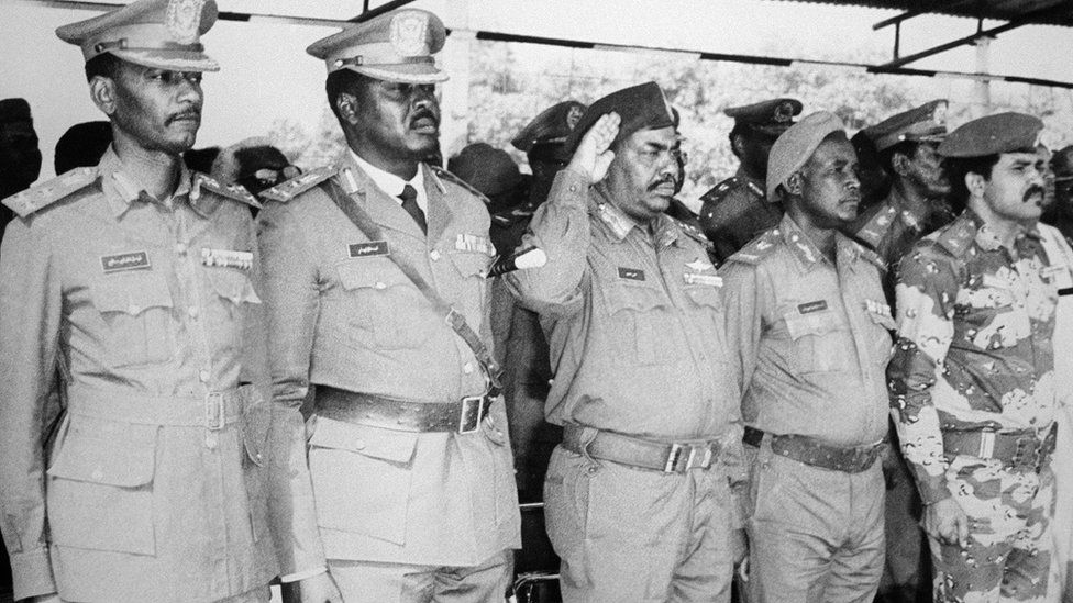 President Omar al-Bashir (centre) came to power after a coup in 1989