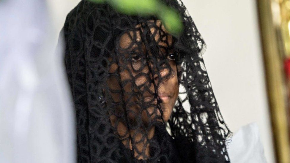 Grace Mugabe sit at funeral wake of her husband the late former Zimbabwean president Robert Mugabe on September 12, 2019, at the Blue Roof mansion in Harare