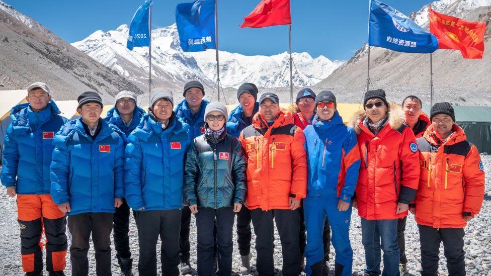 Members of Chinese surveying team pose for photos at Everest Base Camp on May 10, 2020 in Shigatse, Tibet Autonomous Region of China.