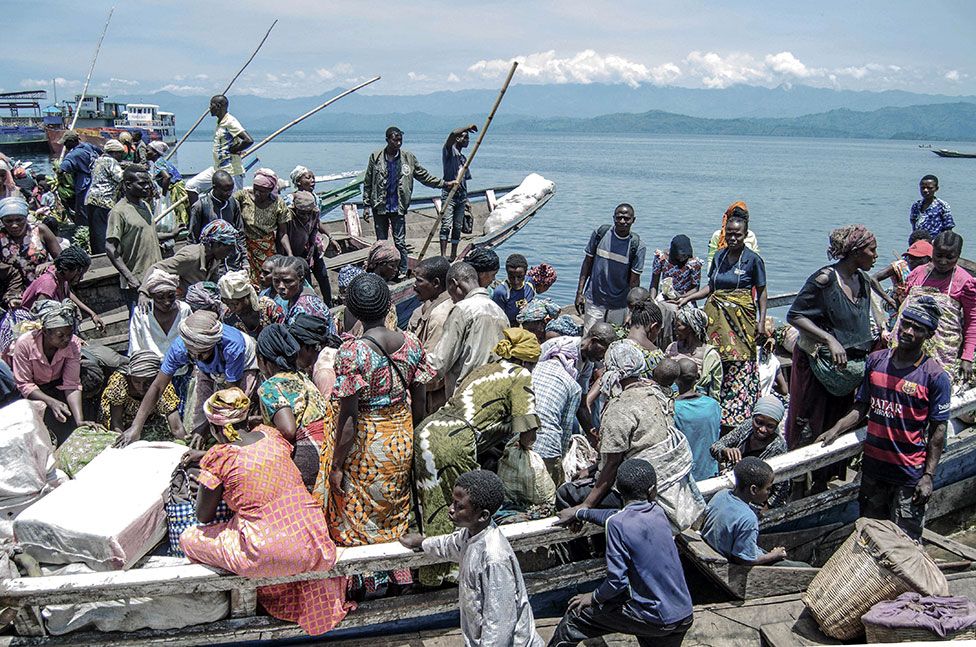 Vendors and shoppers at Kituku market on the shores of Lake Kivu in Goma