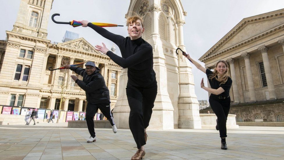 Dancers Thomas O"Flaherty, Jess Murray and Jess Rowe perform at the Chamberlain Square in Birmingham to launch the Birmingham 2022 Festival.