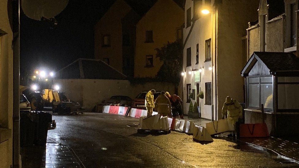 Erecting flood barriers in Stonehaven
