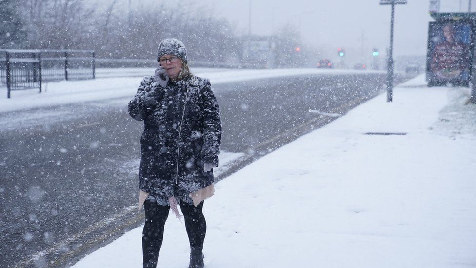 Woman walks through the snow in Thornaby