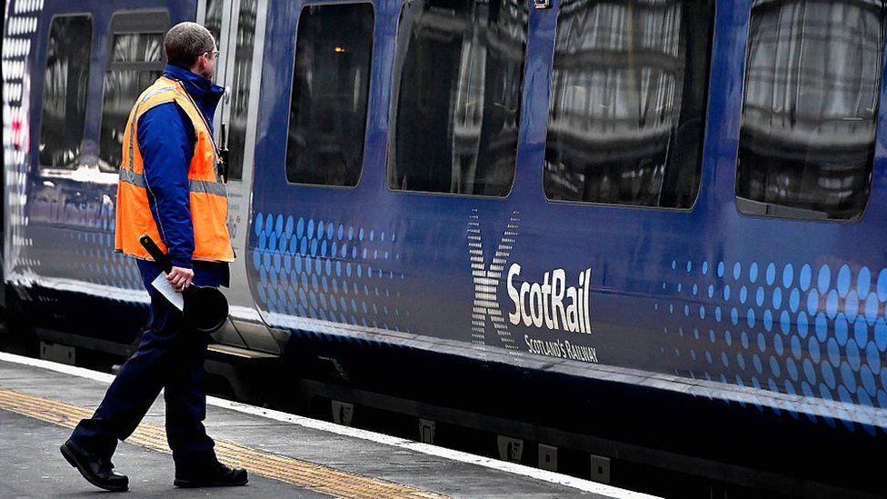 ScotRail train with staff member