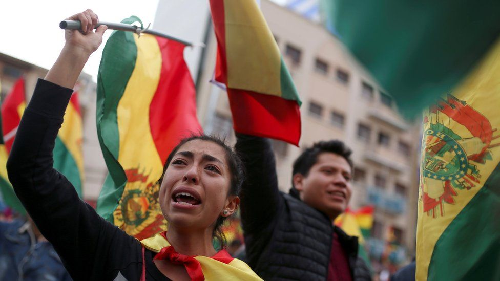 Protesters celebrate about Bolivian President Evo Morales announces his resignation