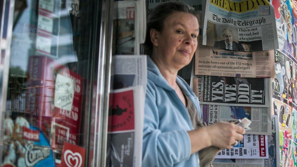 A woman sells newspapers at a kiosk of Gibraltar during the last day of Gibraltar as member of the European Union on January 31, 2020 in Gibraltar,
