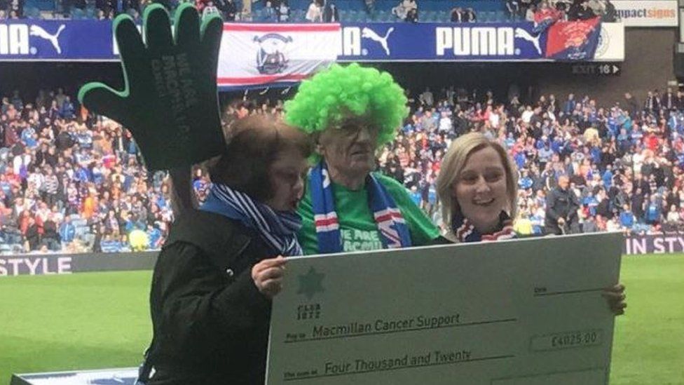 Mr Burkhill was presented with a cheque for £4,025 for Macmillan Cancer Research at half time during the game with Hibernian