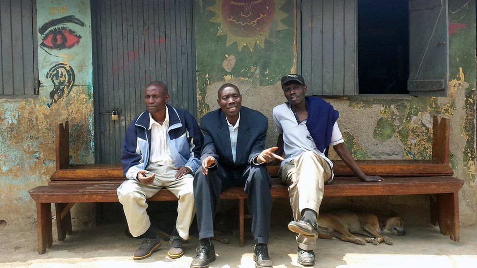 Bus ticket collector Martin (centre) and two friends